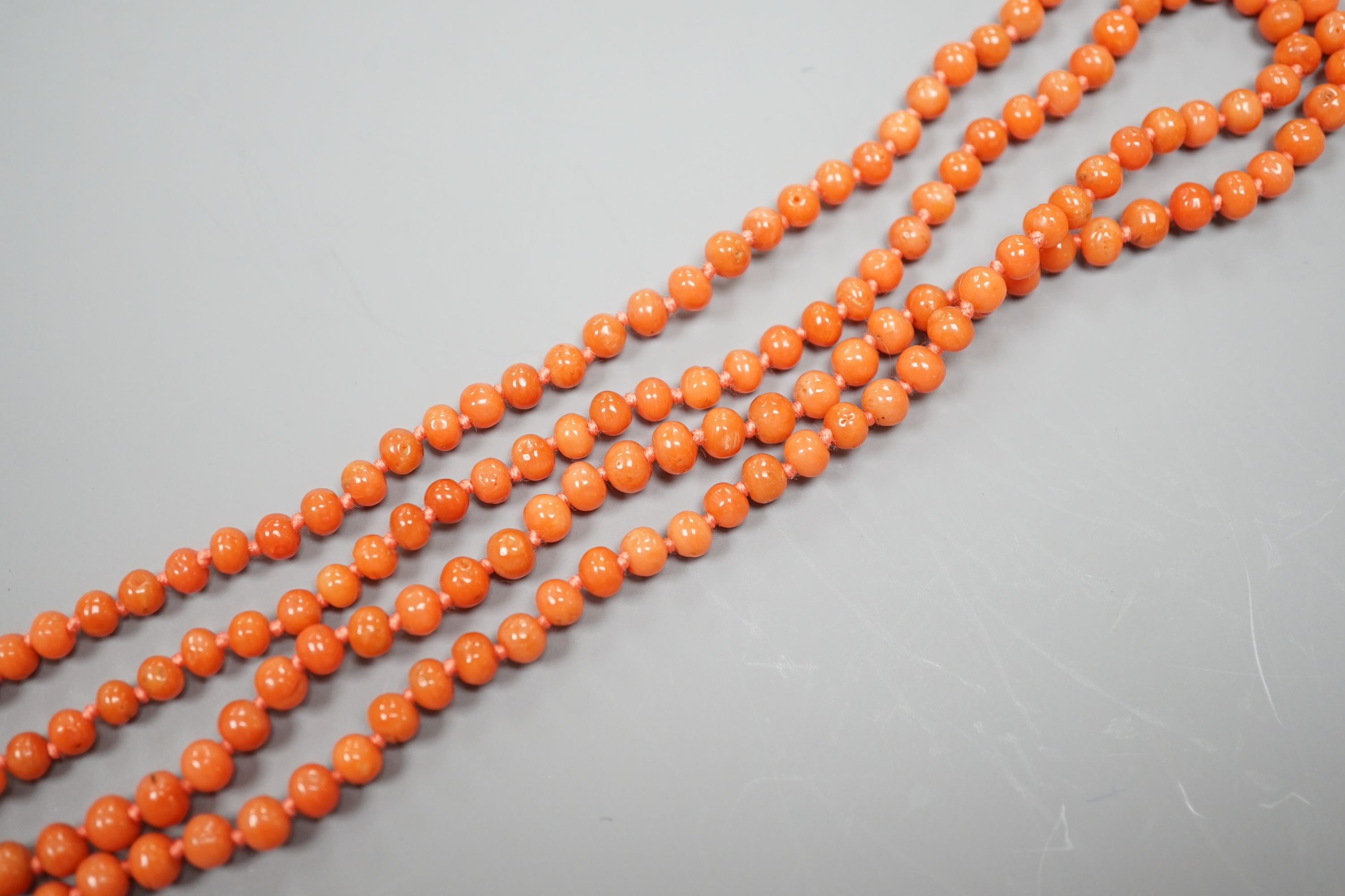 A single strand graduated coral bead necklace, 154cm, gross weight 48 grams.